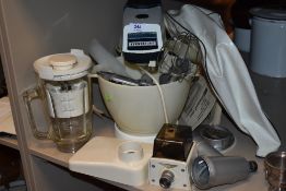 A Kenwood kitchen Chef with accessories and instructions