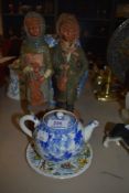 A small Chinese export tea pot circa 1850 having blue and white design with tea strain inner and