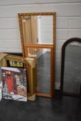 A selection of prints and picture frames including mirrors