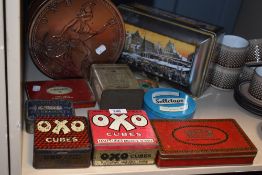 A selection of vintage transfer printed advertising tins including Craven A and OXO