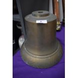 A heavy brass fire bell or similar.