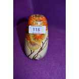 An art deco sugar sifter by Clarice Cliff Newport pottery decorated with traditional landscape and