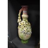 A late 19th/early 20th century statement floor vase having green and mauve mottled ground with