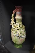 A late 19th/early 20th century statement floor vase having green and mauve mottled ground with