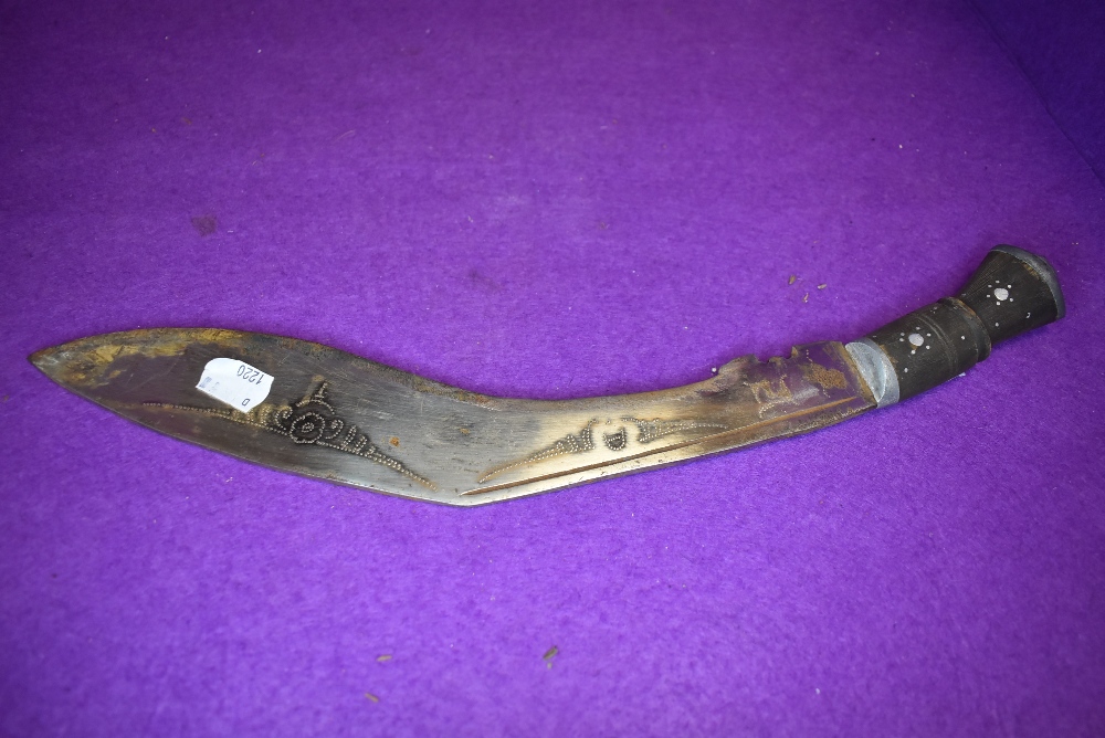 A Indian/Nepalese Kukri having chased detail to blade and inlaid metal work to bone handle. - Image 2 of 2