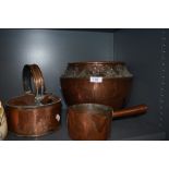 A trio of vintage copper collectables,pan,floral embossed planter and kettle.