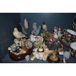 An assortment of animal figurines and similar.