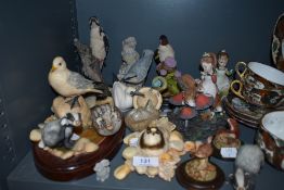 An assortment of animal figurines and similar.