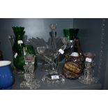 An assortment of art glass, candle sticks and glasses.