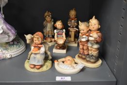 Eight Hummel figures to include Child in Bed wall plaque, Good Friends, Two Boys and other (af)