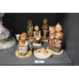 Eight Hummel figures to include Child in Bed wall plaque, Good Friends, Two Boys and other (af)