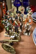 A selection of Napoleonic figures by Capodimonte and brass cannon