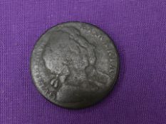 A 1694 William and Mary Half Penny, date indistinct but visible