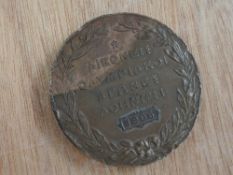 A 1906 Athens Olympic Games Participation Bronze Medal, depicting Victory offering a laurel wreath