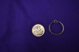 A 1913 George V Gold Sovereign along with a 1.5g 9ct mount