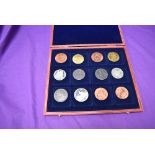 Twelve Reproduction British and Commonwealth Coins 1808-1837, all crown size, in wooden case