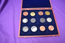 Twelve Reproduction British and Commonwealth Coins 1808-1837, all crown size, in wooden case