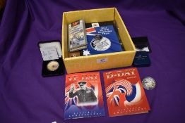 A box containing mainly WW2 Commemorative Coins, Alderney Silver Proof £1, Alderney 2013 Crown, D-