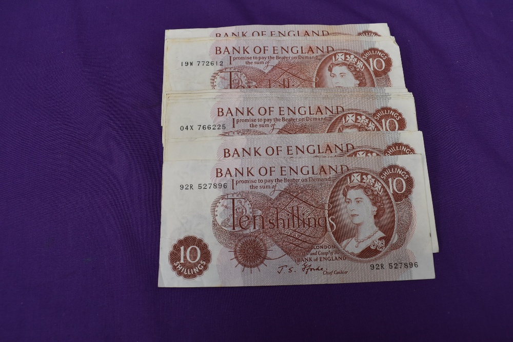 A collection of 43 used J S Fford 10 Shilling Banknotes, number number letter including 92R 527896