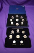 A box of GB Coins coining two sets of Queen Elizabeth II Coins, both gold plated and colour