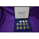 A part set of The Legendary Aircraft Collection of Brass Coins in display case, 11 coins in total