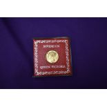 A 1857 Queen Victoria Shield Back Gold Sovereign, in plastic case