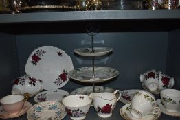 A mixed lot of general ceramics including cups and saucers and cake stand with three tiers.