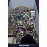 A box of costume jewellery including wrist watches, bangles, necklaces, white metal napkin rings