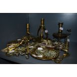 A selection of brass wares including ships chamber stick and bridge counter