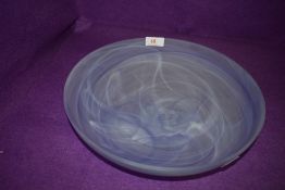 A smoked art glass bowl having white and purple hues