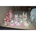 A selection of dressing table items including graduated jug set and storage jars