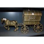 A large brass cast figure of a shire horse and gypsy caravan