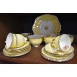 A part tea service by Delphine China having yellow on cream ground