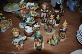 Nine Goebel figures including Tree Trimming Time BH12, Good Friends, Chimney Sweep Boy, Boy with