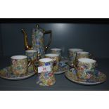 A part coffee service having gilt and paisley transfer print design