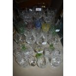 An assortment of vintage glass including etched and coloured examples.