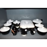 A selection of black and white kitchen wares including Denby soup dishes