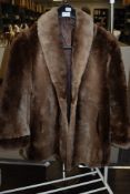 A ladies vintage fur coat.