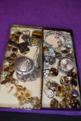 A selection of costume jewellery including polished stone bracelets, clip earrings, Joyas watch face