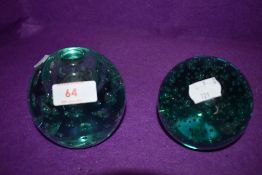 Two aqua green glass paper weights or dumps