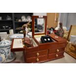 A jewellery box and a variety of cufflinks and brooches.