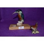 A ceramic figure of a kingfisher hand decorated with a similar Beswick wren