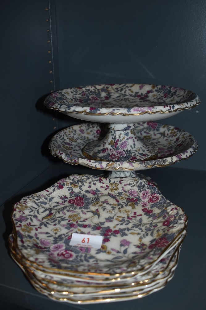 A selection of antique cake and dinner plates having chintz pattern and gilt edge work