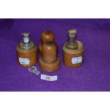 A pair of turned box wood case medical bottles