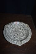 A crackle glazed German pottery ashtray.