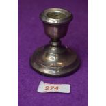 A small HM silver candle stick of squat form