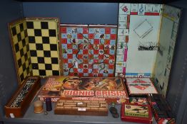 A mixed lot of vintage board games amongst which are Bionic Crisis, dominos, monopoly and more.