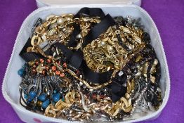 A large selection of metal costume jewellery necklaces including gold plated and pewter style etc