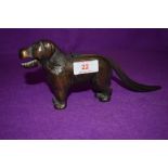 A vintage nutcracker in the form of a dog stamped made in England with reg mark