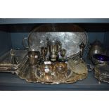 A large lot of plated ware including toast rack,serving dish with blue glass liner, tureen and